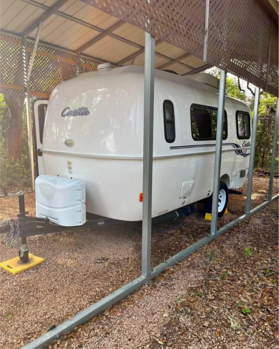Compact white Casita travel trailer, perfect for your next RV rental. Parked under a protective carport.. Casita Casita Trailer 2020