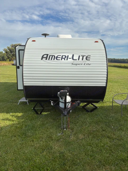 Front view of an Ameri-Lite RV rental parked on grass, ready for adventure. Perfect for your next trip!. Gulf Stream Ameri-Lite 2019