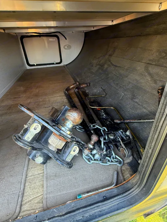 RV rental storage: weight distribution hitch with tow ball, chains, and sway bars. Ready for safe trailer towing.. Heartland Trail Runner 2022