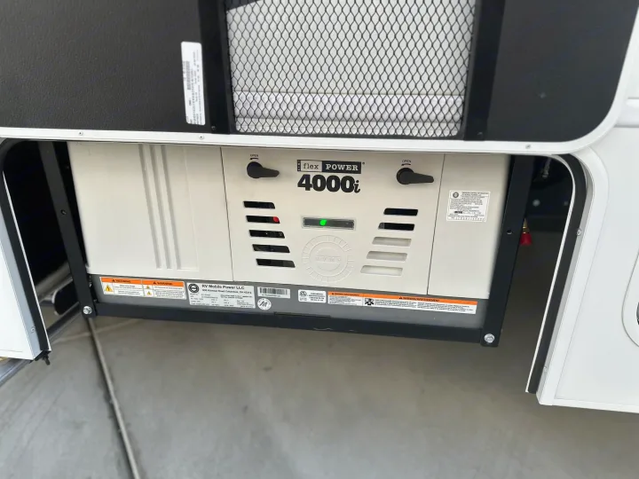 This flex POWER 4000i generator for an rv rental is shown with a green light on, providing mobile power.. JAYCO REDHAWK SE 22TF 2025