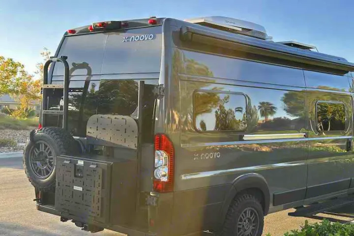 Adventure-ready X Noovo rv rental camper van, featuring rooftop AC, rear ladder, and gear storage.. Noovo Plus 2025