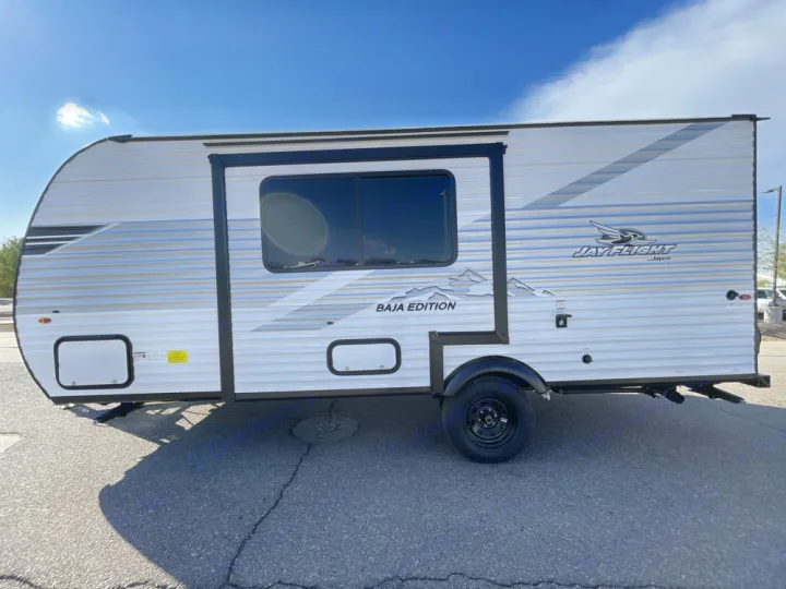 This Jayco Jay Flight Baja Edition travel trailer is ready for your RV rental adventure, offering a compact camper experience.. Jayco Jay Flight SLX Baja Edition 2025
