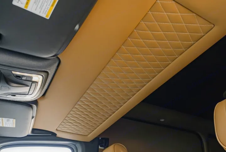 Premium RV rental interior showcasing a custom tan quilted headliner and overhead console. Enjoy luxury on the go.. Mercedes Benz Sprinter By Legends Executive 2022