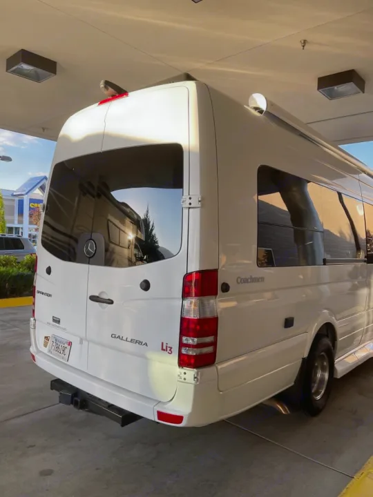 Rear view of a white Mercedes Sprinter van RV, branded Coachmen Galleria Li3. Ideal for your next rv rental adventure.. Coachmen Galleria 2020