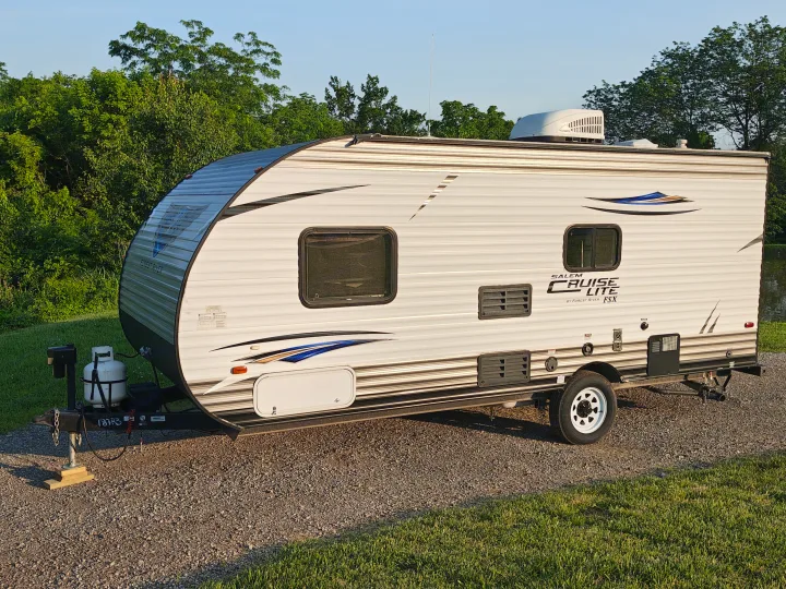 Salem Cruise Lite FSX travel trailer RV rental parked on gravel, ready for your next outdoor adventure.. Forest River Salem FSX 2018