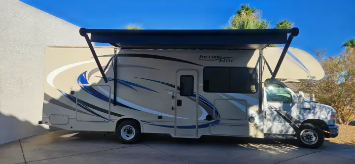 Thor Freedom Elite Class C RV rental with extended awning, ready for your next travel and camping adventure.. Thor Freedom Elite 2017