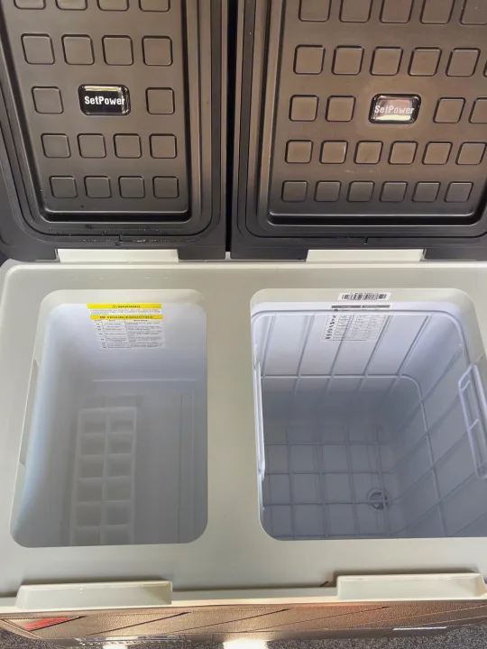 Open SetPower dual-zone portable fridge/freezer, ideal for rv rental trips. Features separate compartments & ice tray.. Ram Promaster 2022