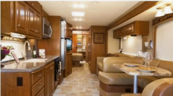 Explore comfort on the road! This inviting RV rental features a full kitchen, dining booth, and living area for your next adventure.. Thor Miramar 2015