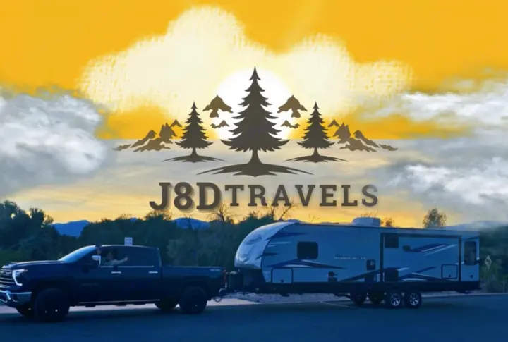 J8DTRAVELS: A black pickup truck towing a large travel trailer (RV) under a scenic sky. Ideal for your next rv rental adventure!. Forest River Cherokee Alpha Wolf 2021