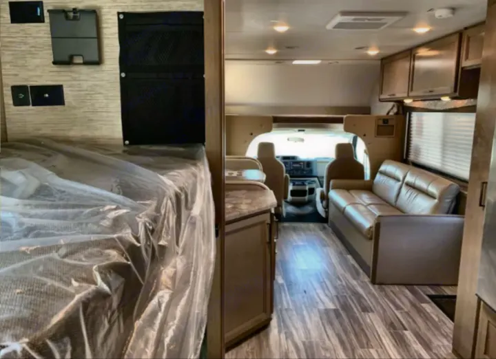 RV rental interior with bunk bed (covered), sofa, and front cabin; showcasing wood-look flooring and amenities.. Thor Four Winds 2023
