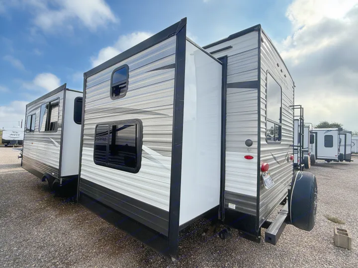 Discover this spacious rv rental travel trailer, featuring extended slide-outs, parked in an RV lot and ready for your adventure.. Jayco Jay Flight 2018
