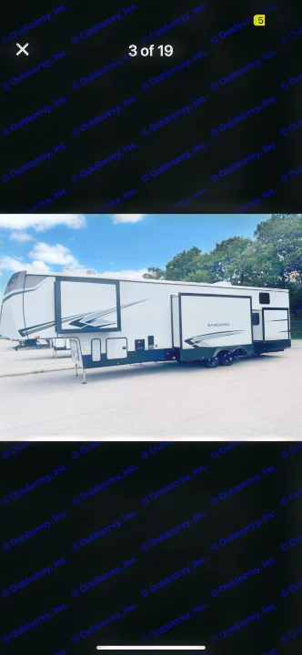 Spacious white Sandpiper fifth-wheel RV rental with slide-outs, perfect for camping and travel adventures.. Forest River Sandpiper 2024