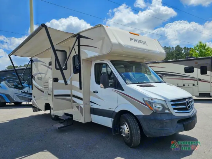 White & beige Class C Sprinter RV rental with extended awning, parked outside. Perfect for your next adventure.. Coachman Prism 2200 LE 2017