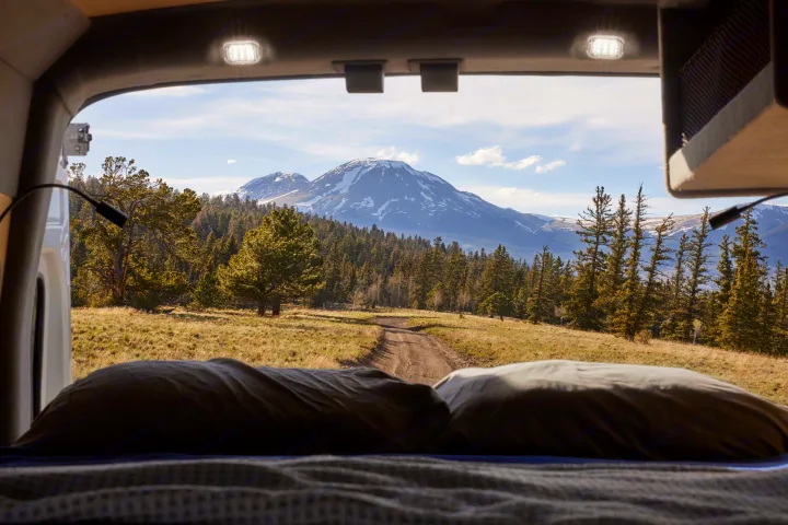 Wake up to stunning mountain views from your comfortable rv rental bed. Explore nature on your next adventure.. Ford Transit 2023