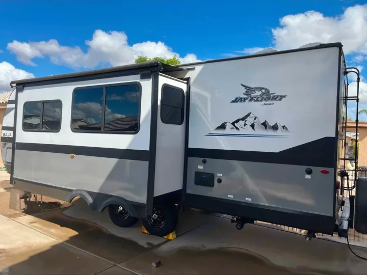 This Jayco Jay Flight travel trailer, perfect for an RV rental, is ready for your next outdoor adventure.. Jayco Jay Flight Baja Edition 2023