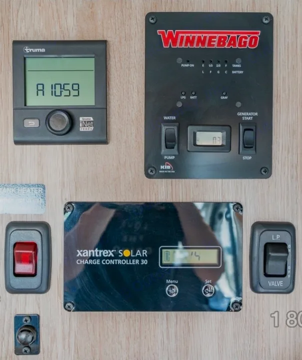 RV rental control panel: Truma thermostat, Winnebago main panel, Xantrex solar charge controller, water pump, generator, LP gas valve.. Winnebago Solis 2025