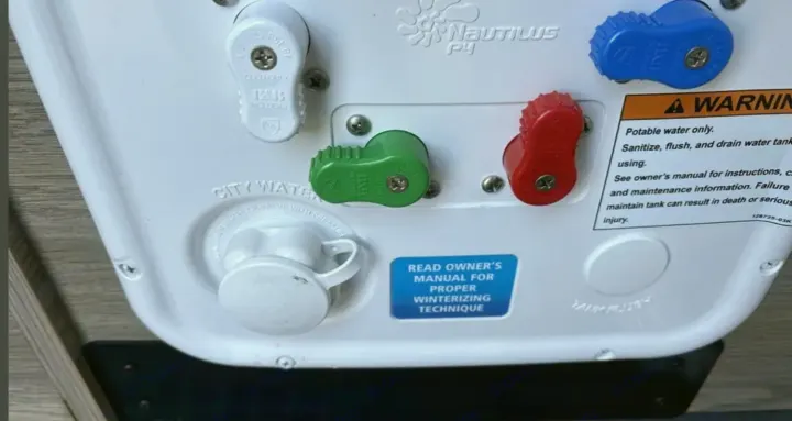 RV rental water control panel with Nautilus P3 valves, city water hookup, and winterizing instructions.. Winnebago Solis 2025