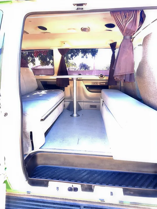 Functional rv rental interior with convertible sleeper sofas and dining table for comfortable travel.. Escape Trailer Industries E150 XLT 2011