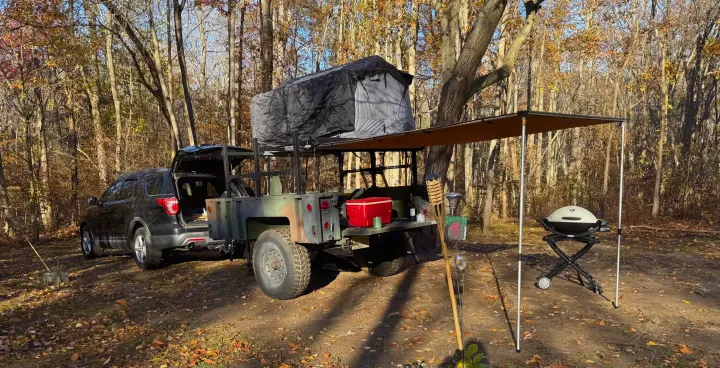 Overlanding setup with SUV, trailer, rooftop tent & awning. Great for an RV rental adventure in the woods.. Silver Eagle Manufacturing M1102 2013