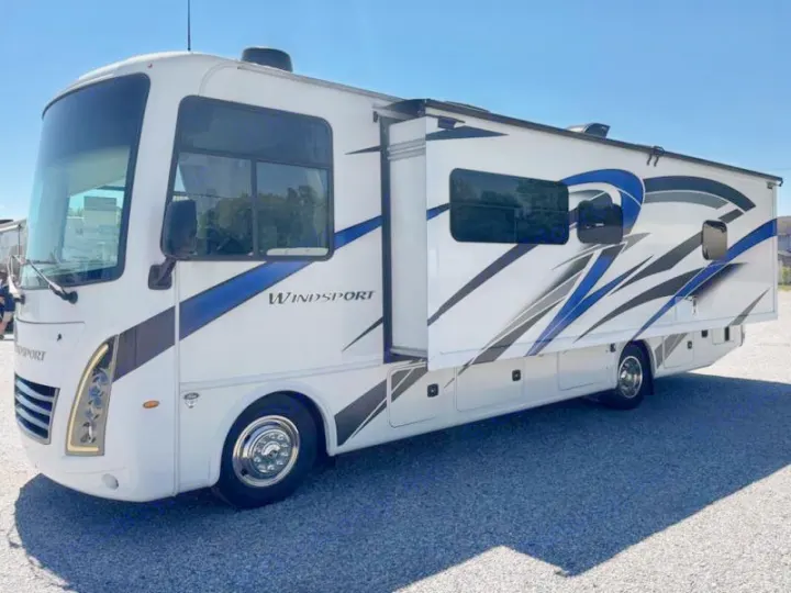 Spacious white Thor Windsport Class A RV rental with blue/black graphics, extended slide-out, ready for your adventure.. Thor Windsport 2023