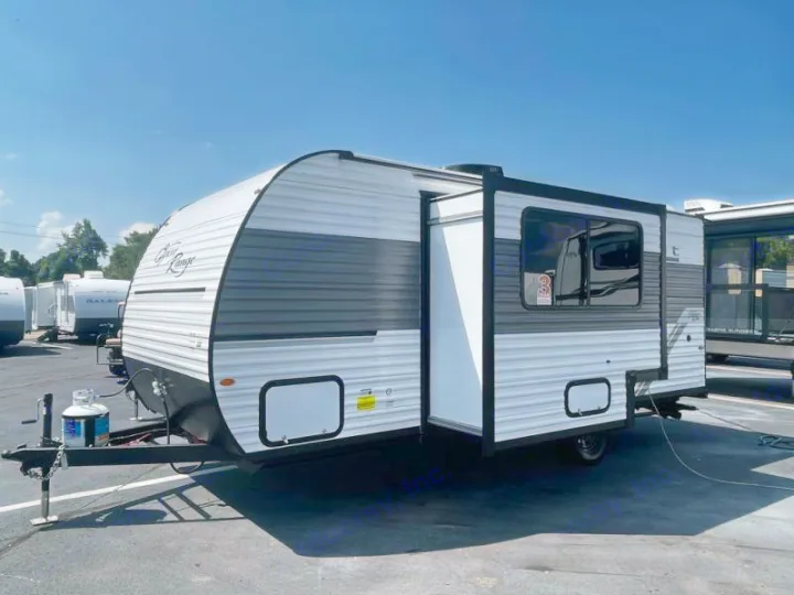 Explore the outdoors with this white & gray travel trailer, ideal for your next RV rental trip.. Open Range Colt MBS 18 2026
