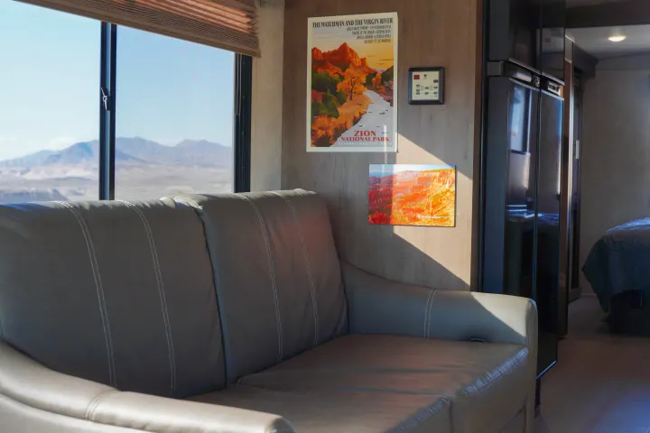 Cozy RV rental interior with a comfy sofa, Zion National Park decor, and breathtaking desert mountain views from the window.. FR3 FR3 Motorhome 2019