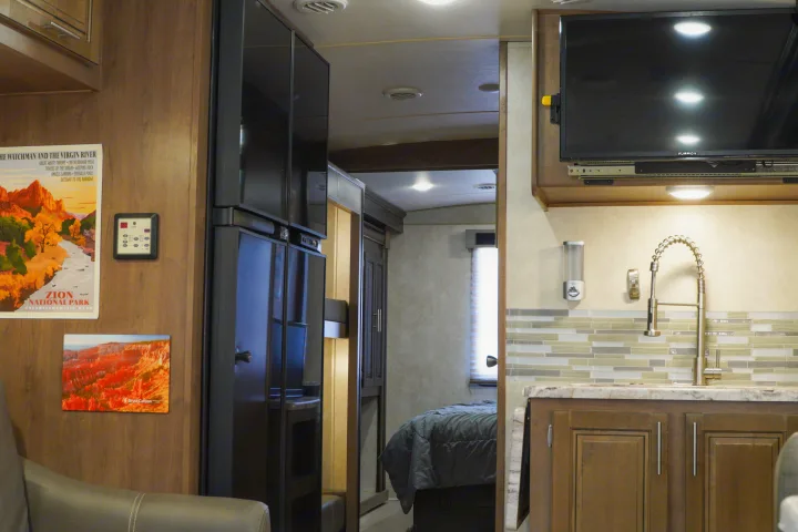 Cozy RV rental interior featuring a modern kitchen, entertainment area, and comfy bedroom, ready for national park adventures.. FR3 FR3 Motorhome 2019