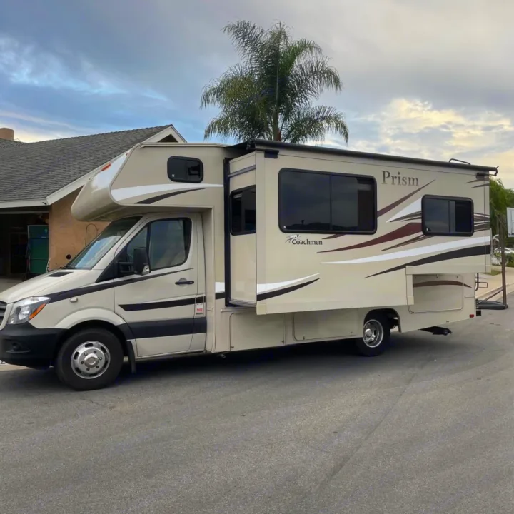 Beige Coachmen Prism Class C RV with slide-out extended, ideal for your next rv rental adventure. Parked on asphalt.. Coachman Prism 2200 LE 2017