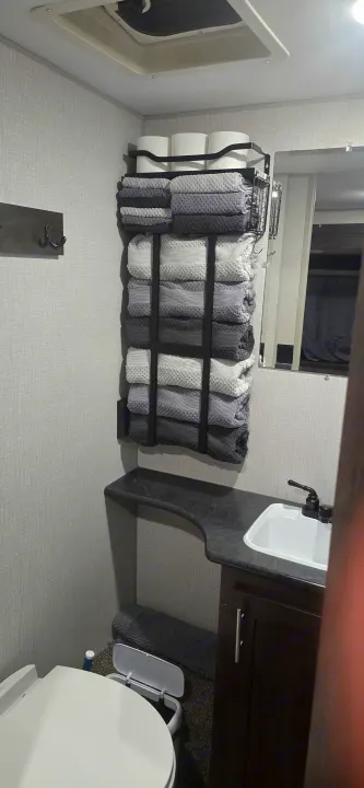 RV rental bathroom: compact, efficient space with towel storage, sink, toilet, and mirror for comfort on your journey.. KZ 301BHKSE 2021