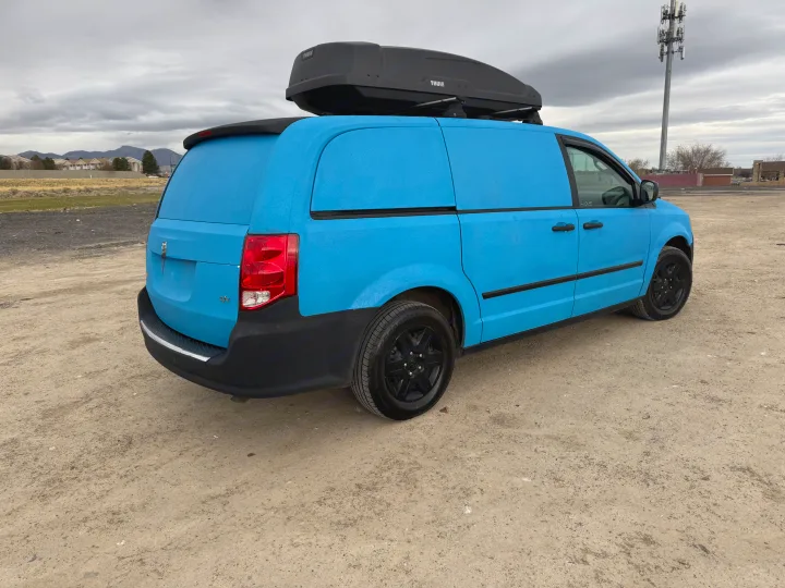 Textured blue customized van with Thule roof box for rv rental. Ready for adventure and travel.. Ram C/V Tradesman 2014