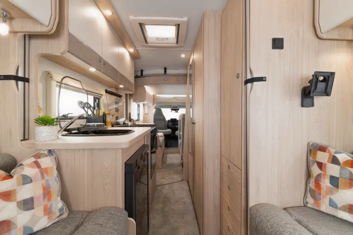 Bright and modern rv rental interior showcasing a full kitchen, living area, and central aisle.. Elddis Whirlwind GT 196 2026