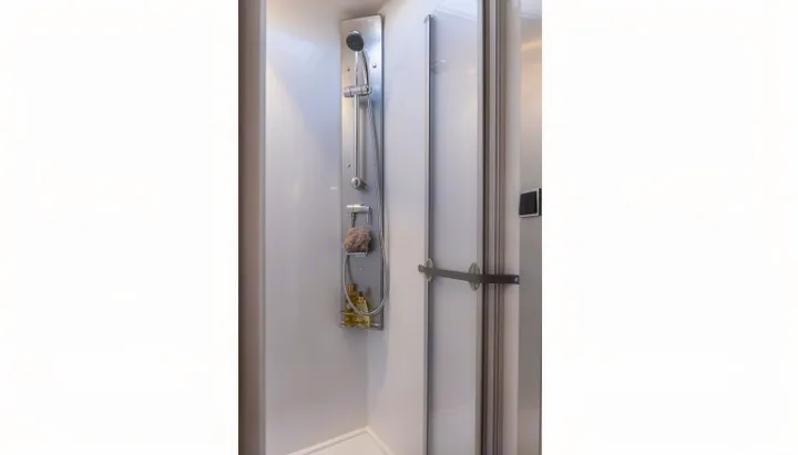 Inside an RV rental: a clean, modern shower with an adjustable head, shelf, and glass door for comfort.. PILOTE P726 C 2026