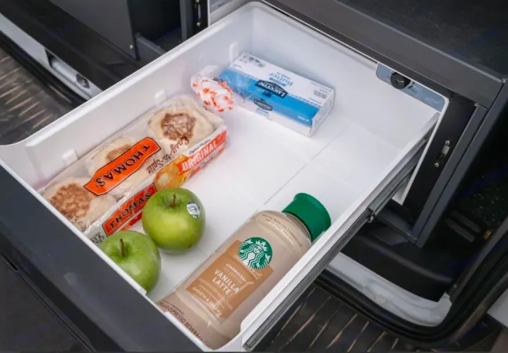 Inside an RV rental fridge: Thomas' English muffins, green apples, Starbucks Vanilla Latte, and butter for your journey.. Ford Transit 2017