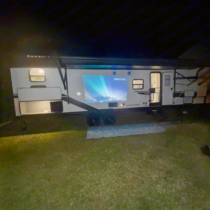Enjoy an **rv rental** evening! This RV features an outdoor projector displaying aurora borealis, ideal for a unique camping experience.. Forest River Tracer Ultra Lite LE 2025