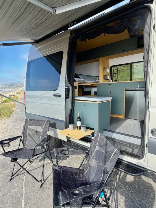 Your next RV rental: Step out to coastal views from this comfy camper van with outdoor chairs & wine.. Mercedes-Benz Sprinter 2025