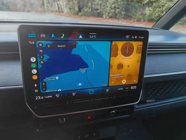 RV rental's screen: navigation to Buntzen Lake, Spotify playing "Bobcaygeon", 5.0°C outside, 23.0°C inside.. Volkswagen ID. Buzz 2025