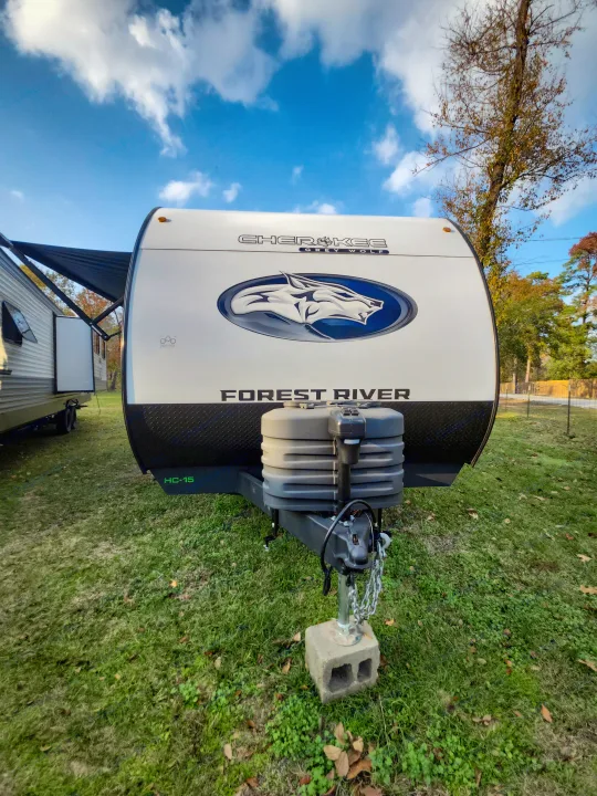 Front view of a white Forest River Cherokee Grey Wolf travel trailer, an ideal RV rental for your outdoor adventure.. Forest River Cherokee Grey Wolf 2025