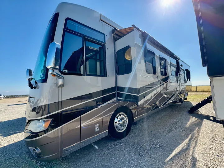Experience travel freedom in this spacious Dutch Star rv rental, parked on gravel under a bright, sunny sky, ready for adventure.. Dutch Star Dutch Star Motorhome 2017