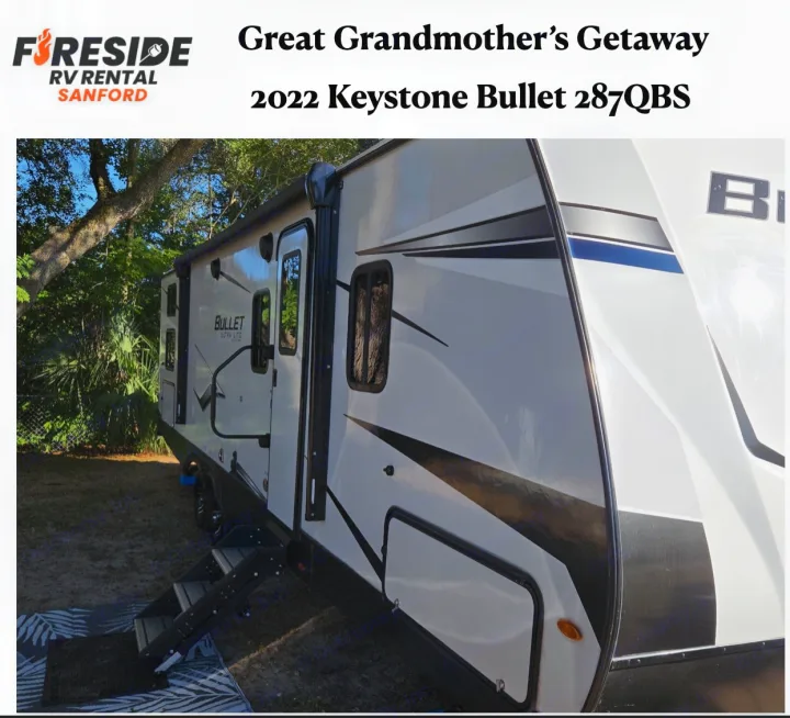 White 2022 Keystone Bullet 287QBS travel trailer RV rental, "Great Grandmother's Getaway," with steps to door.. Keystone Bullet 2022