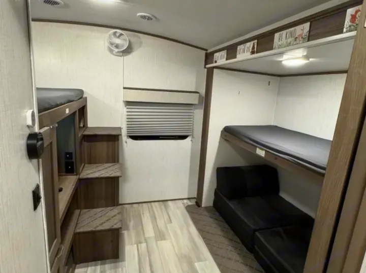 This rv rental offers comfy bunk beds, a pull-out sofa, and integrated steps, perfect for family adventures.. Cruiser RV MPG 2023