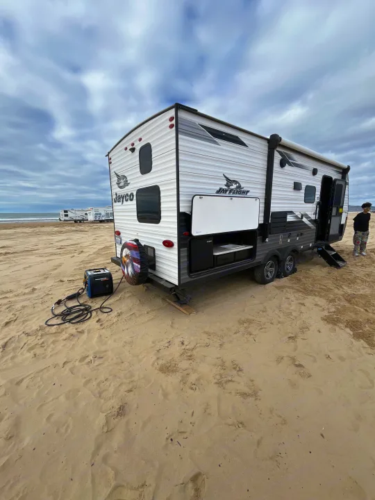 This Jayco RV rental is perfectly set up for beach camping, complete with an open outdoor kitchen and generator on the sand.. Jayco Jay Flight SLX Rocky Mountain Edition 2022