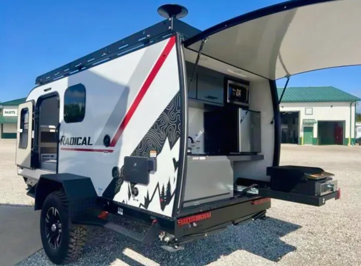 RV rental: RADICAL off-road camper with open rear kitchen, showcasing microwave, fridge, & pull-out griddle for adventurers.. Bontrager Outdoors 12RAD 2025
