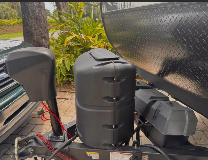 RV rental's front hitch assembly: a black power jack, propane tank cover, and battery boxes are clearly visible.. Forest River No Boundaries NoBo 16.6 2023