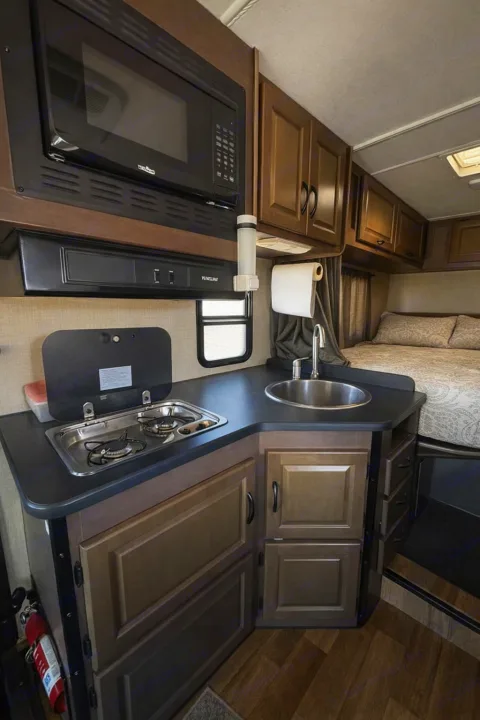 This compact rv rental offers a kitchen with microwave, stove, sink, and a bed. Includes a fire extinguisher for safe travels.. Thor Majestic 2018