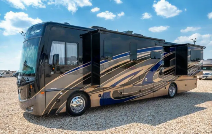 This luxurious black and tan Pace Arrow motorhome with slide-outs extended is ready for your next rv rental adventure.. Fleetwood Pace Arrow 35E 2019