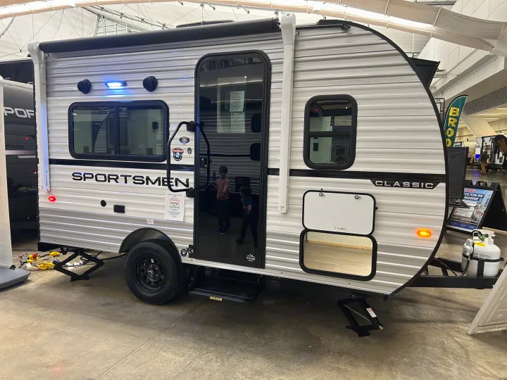 This Sportsmen Classic travel trailer, ideal for an rv rental, is ready for camping adventures, complete with stabilizing jacks and propane.. K-Z 130RD 2026
