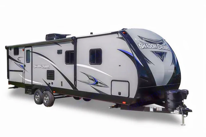 Stylish gray Shadow Cruiser travel trailer, an ideal RV rental. Features black & blue graphics, awning, and multiple windows.. Cruiser RV Shadow Cruiser 2019