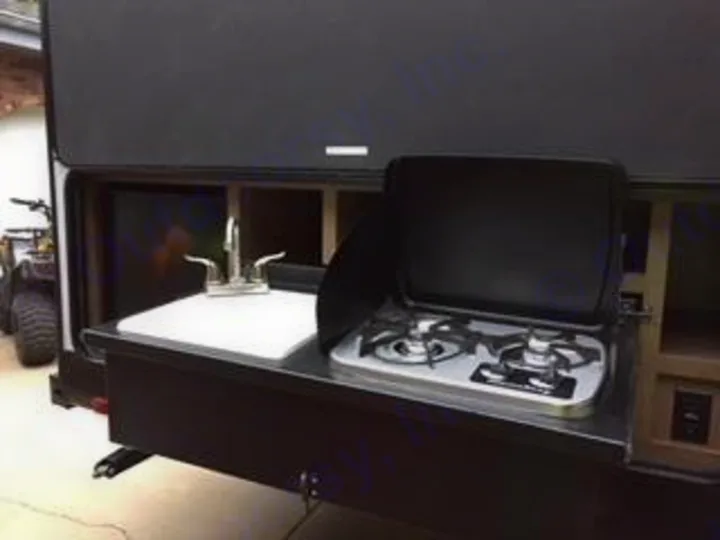 This RV rental features a pull-out outdoor kitchen with a sink, faucet, and two-burner stove for convenient camping.. Cruiser RV Shadow Cruiser 2019