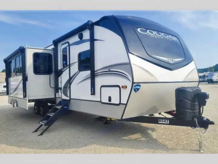 RV rental: Modern Cougar travel trailer with extended slide-outs and steps for easy access.. Keystone RV Cougar 2021