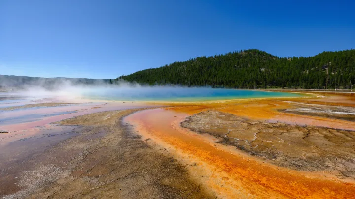 Explore Yellowstone's Grand Prismatic Spring on an RV rental adventure! Witness colorful hot spring landscapes and steaming thermal features.. Ford Roofnest 2024